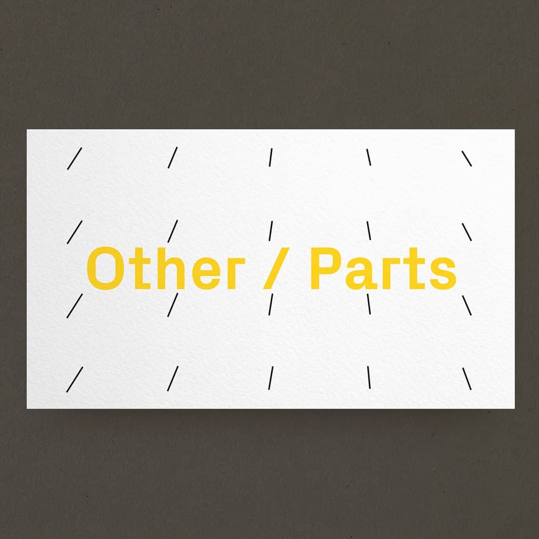 Business card of Other Parts that is white with yellow logo on top