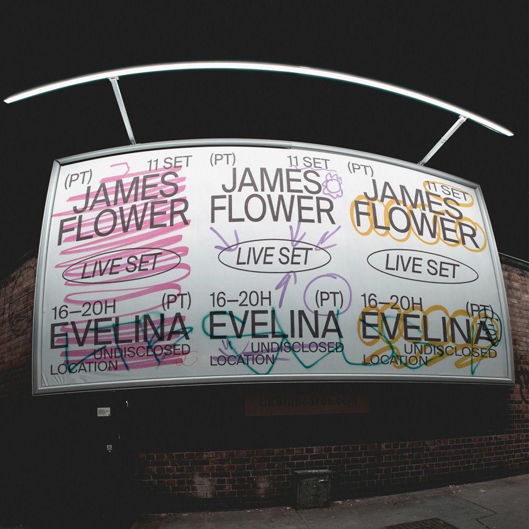 Photo of a billboard at night with typography and handmade colourful lines